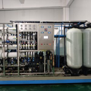 Industrial RO water system on blue skid with FRP pretreatment tanks