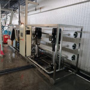 Containerized RO plant beside shipping container for export