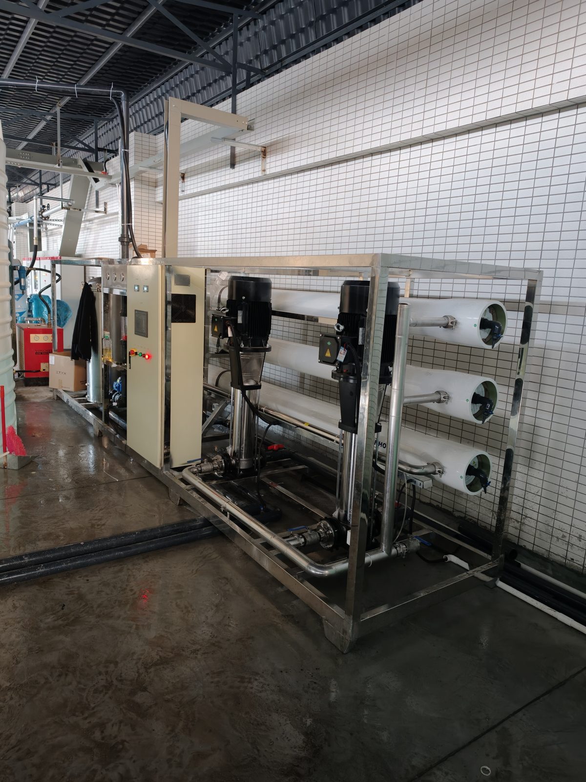 Containerized RO plant beside shipping container for export