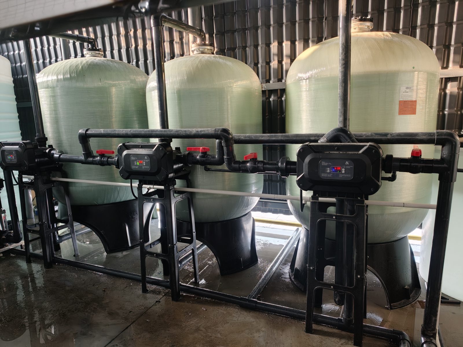 Twin FRP softener tanks with automatic valves