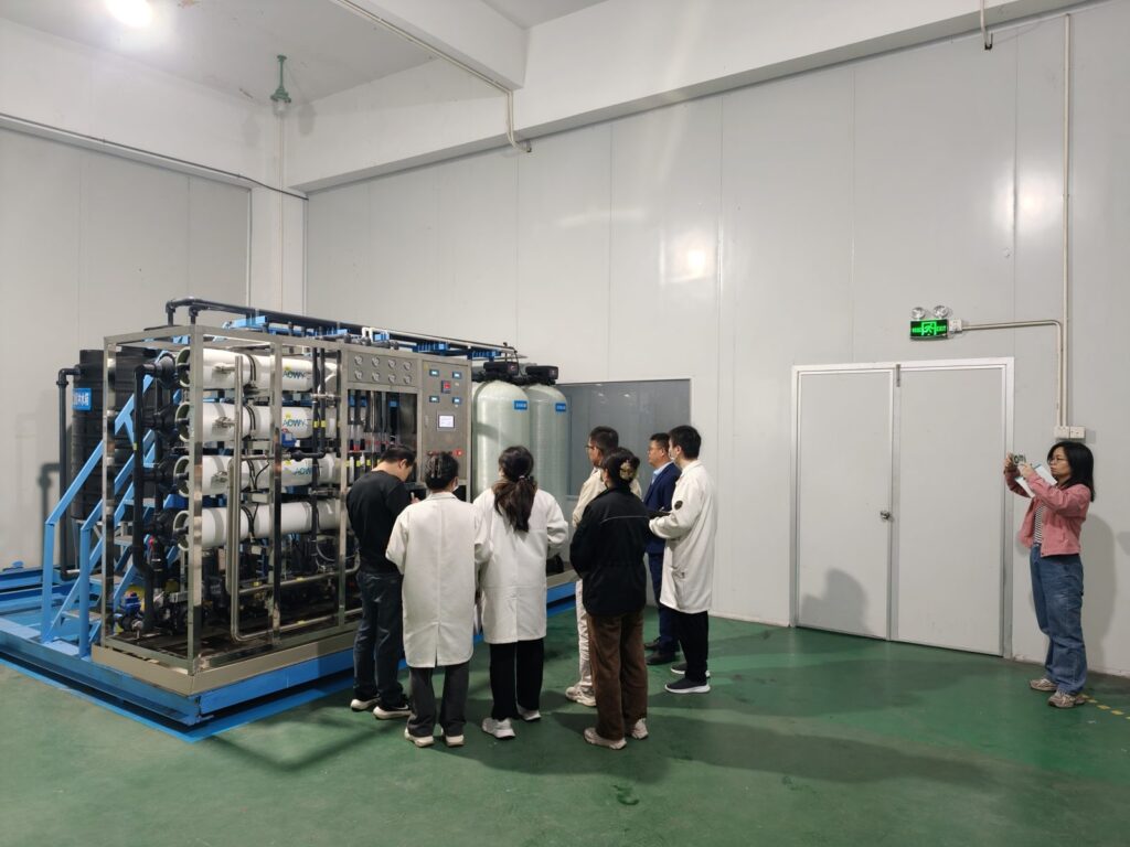 Client delegation inspecting RO plant in factory workshop